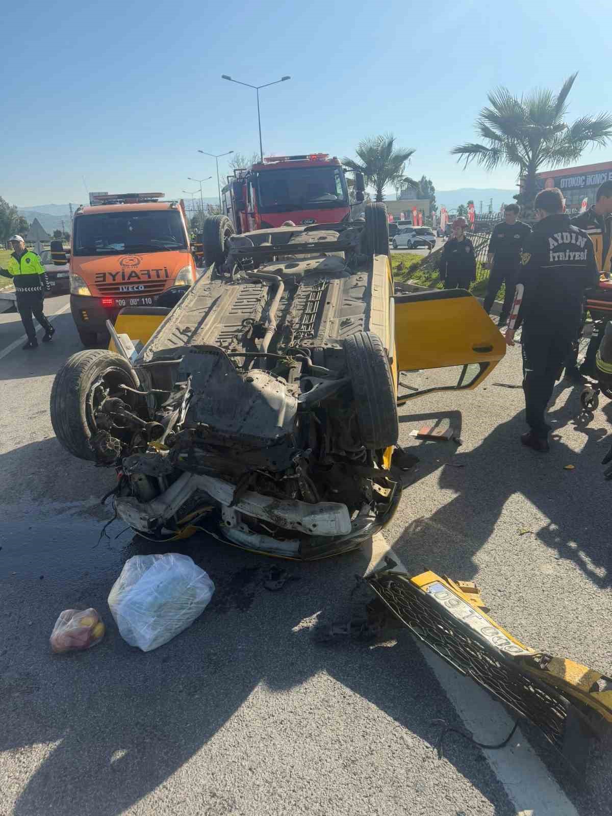 Taksi bariyerlere çarpıp takla attı: 2 yaralı
