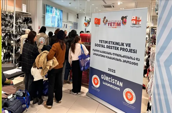 TDV'den Gürcistan'da 650 yetime giyim yardımı